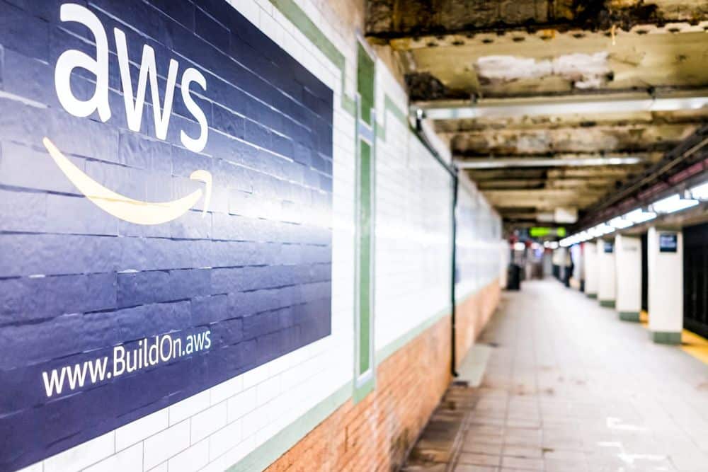 Underground station with AWS advertising on the wall.